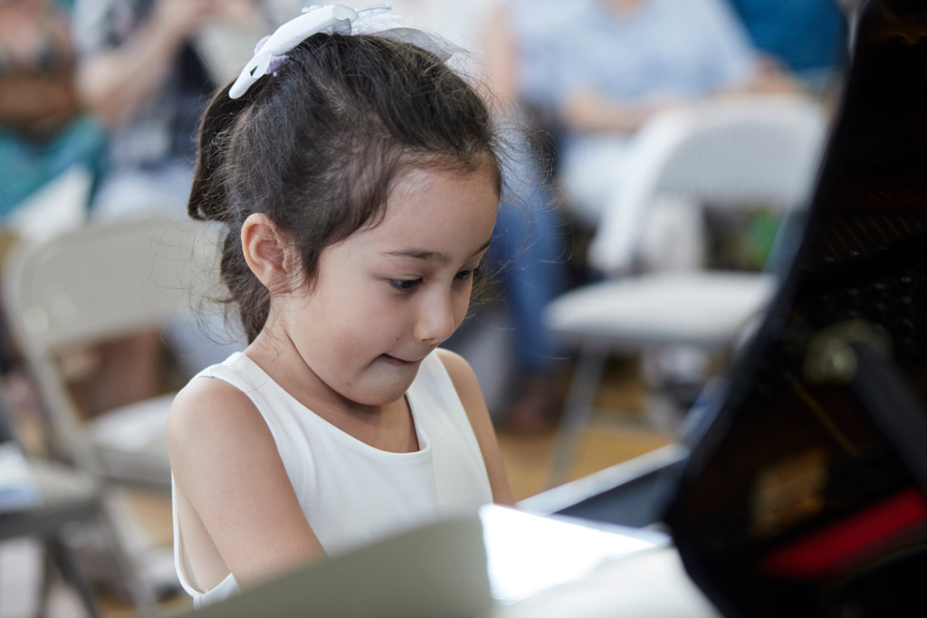 child playing piano