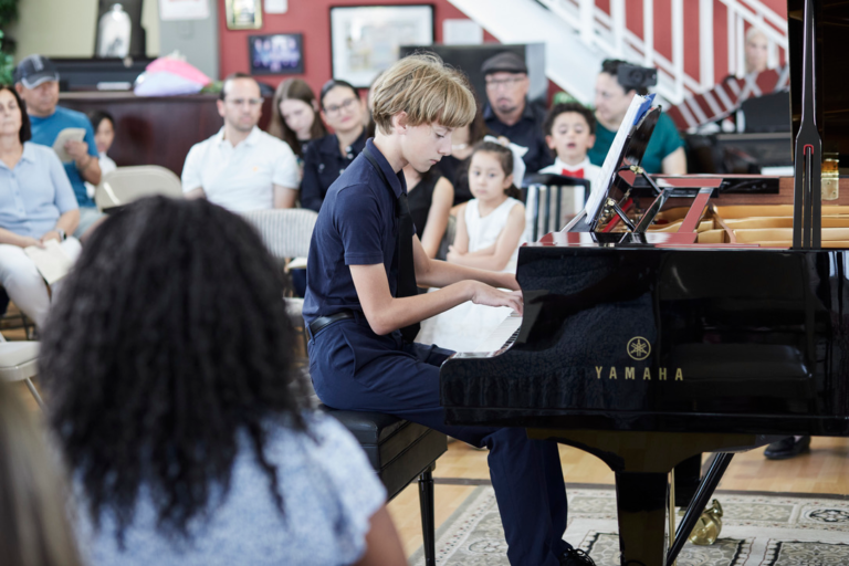 Piano student performing at piano recital