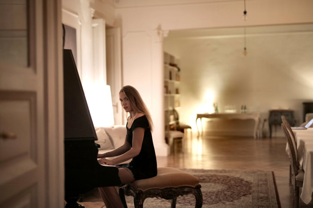 Person playing piano from different angle