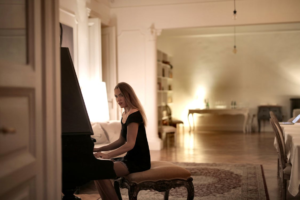 Person playing piano from different angle